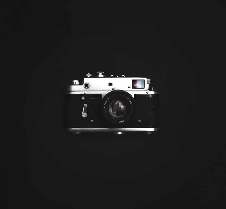 A photograph of a camera representing the importance of visual content for social media